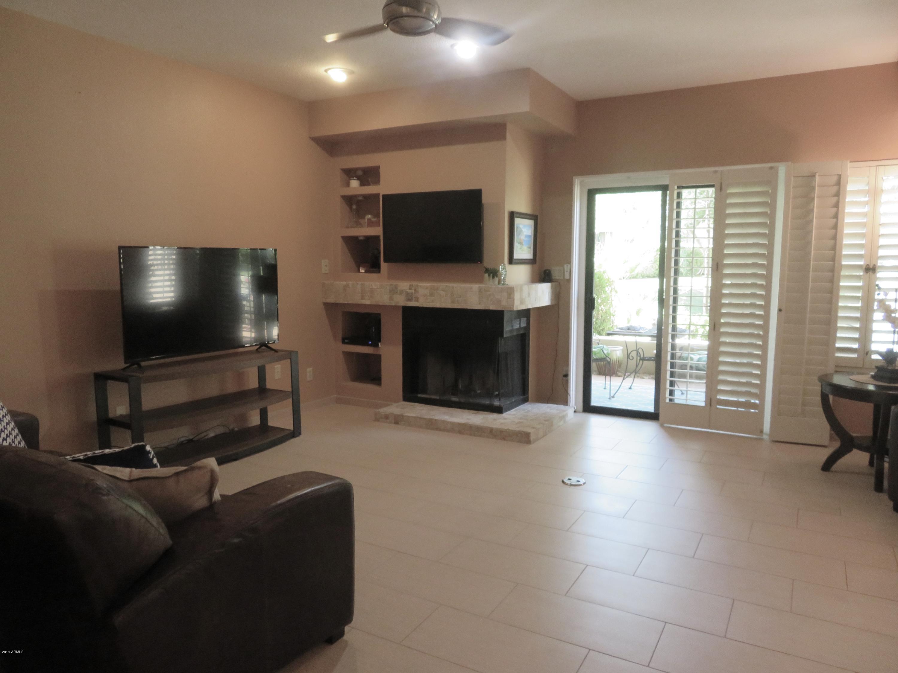 7272 East Gainey Ranch Road, Unit 126 Scottsdale, AZ 85258 - Photo 6 of 56 WOOD BURNING FIREPLACE