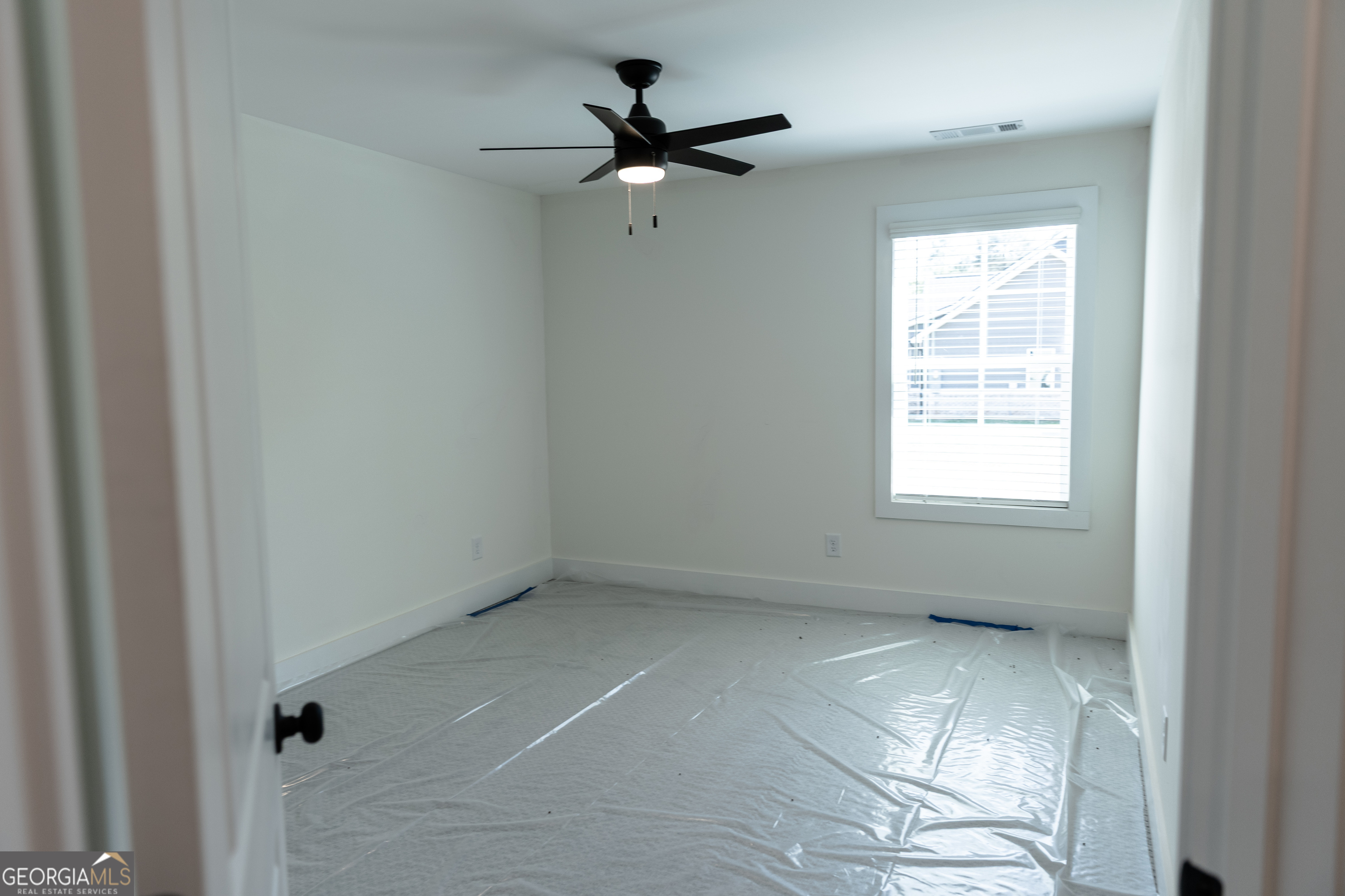 632 Campbell Road Covington, GA 30014 - Photo 35 of 60 a view of an empty room with a window