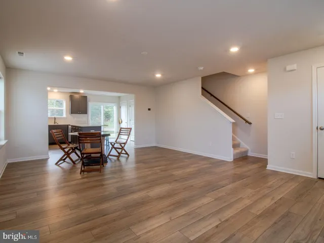 a view of dining room with furniture and wooden floor