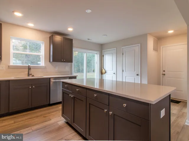 a kitchen with lots of counter space and a sink