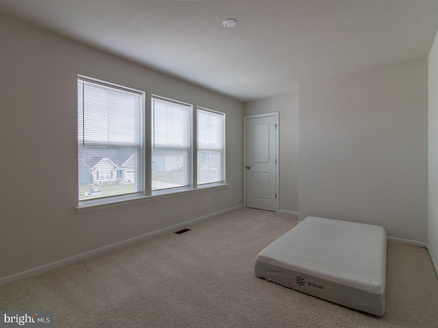 617 R Wilson Loop Georgetown, DE 19947 - Photo 6 of 13 an empty room with windows