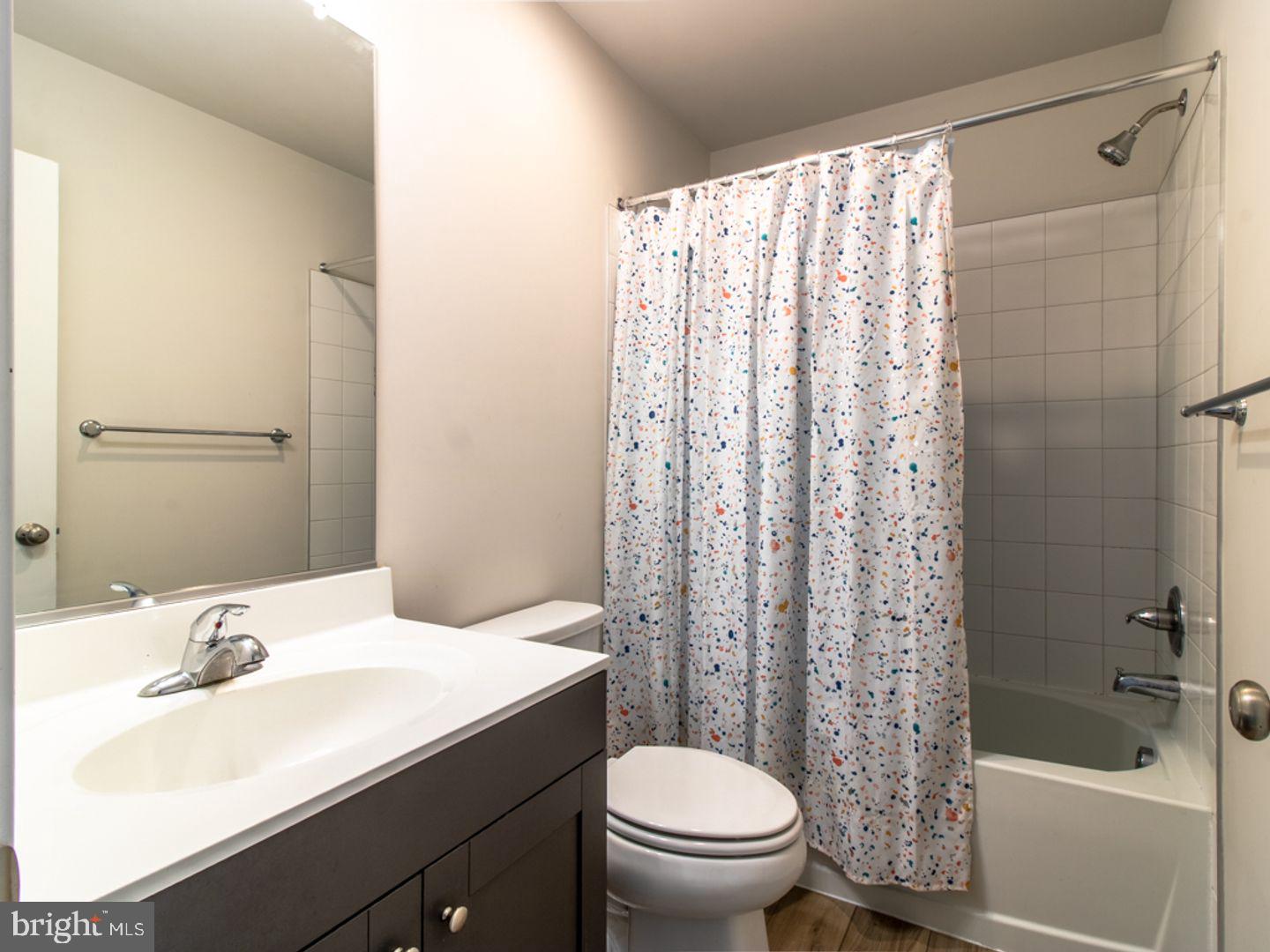 617 R Wilson Loop Georgetown, DE 19947 - Photo 10 of 13 a bathroom with a sink a toilet and shower