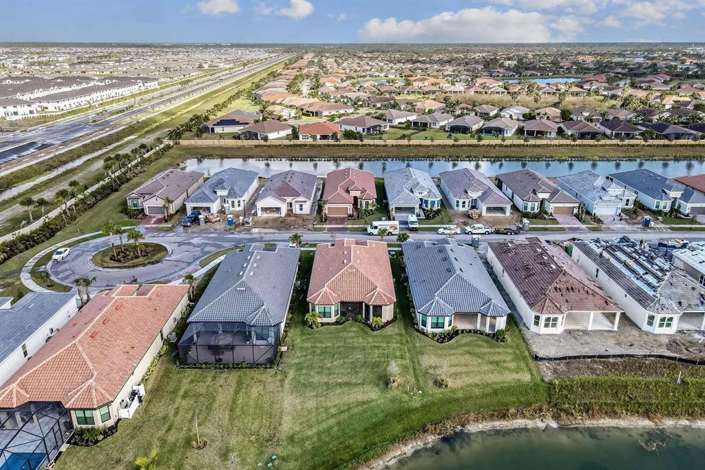 9796 Southwest Santini Rd Port Street Port St. Lucie, FL 34987 - Photo 19 of 29 Arial Rear View of Home