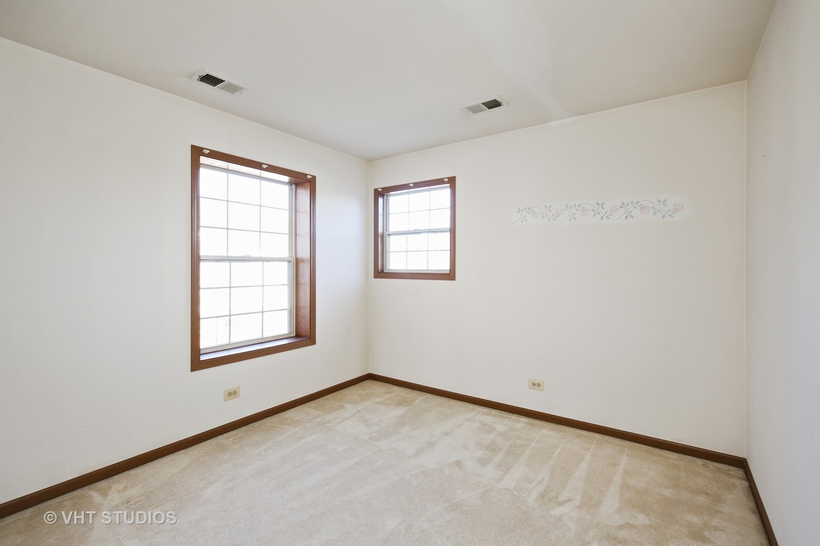 321 Sheffield Drive, Unit 321 Schaumburg, IL 60107 - Photo 14 of 21 an empty room with windows