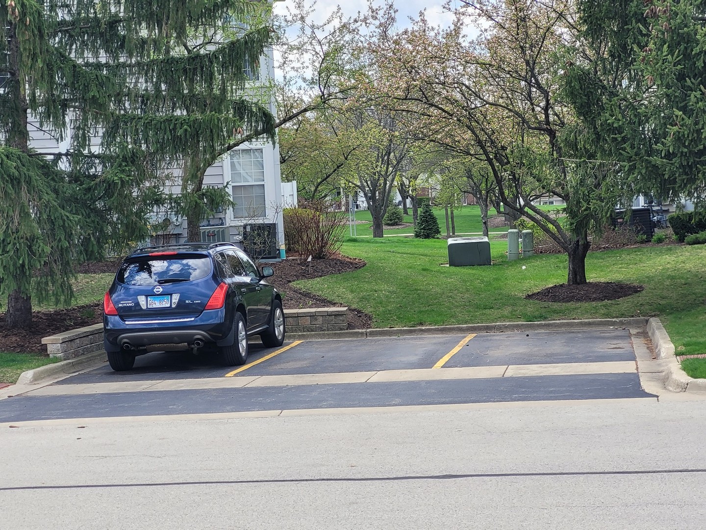321 Sheffield Drive, Unit 321 Schaumburg, IL 60107 - Photo 19 of 21 a view of a car parked in the yard