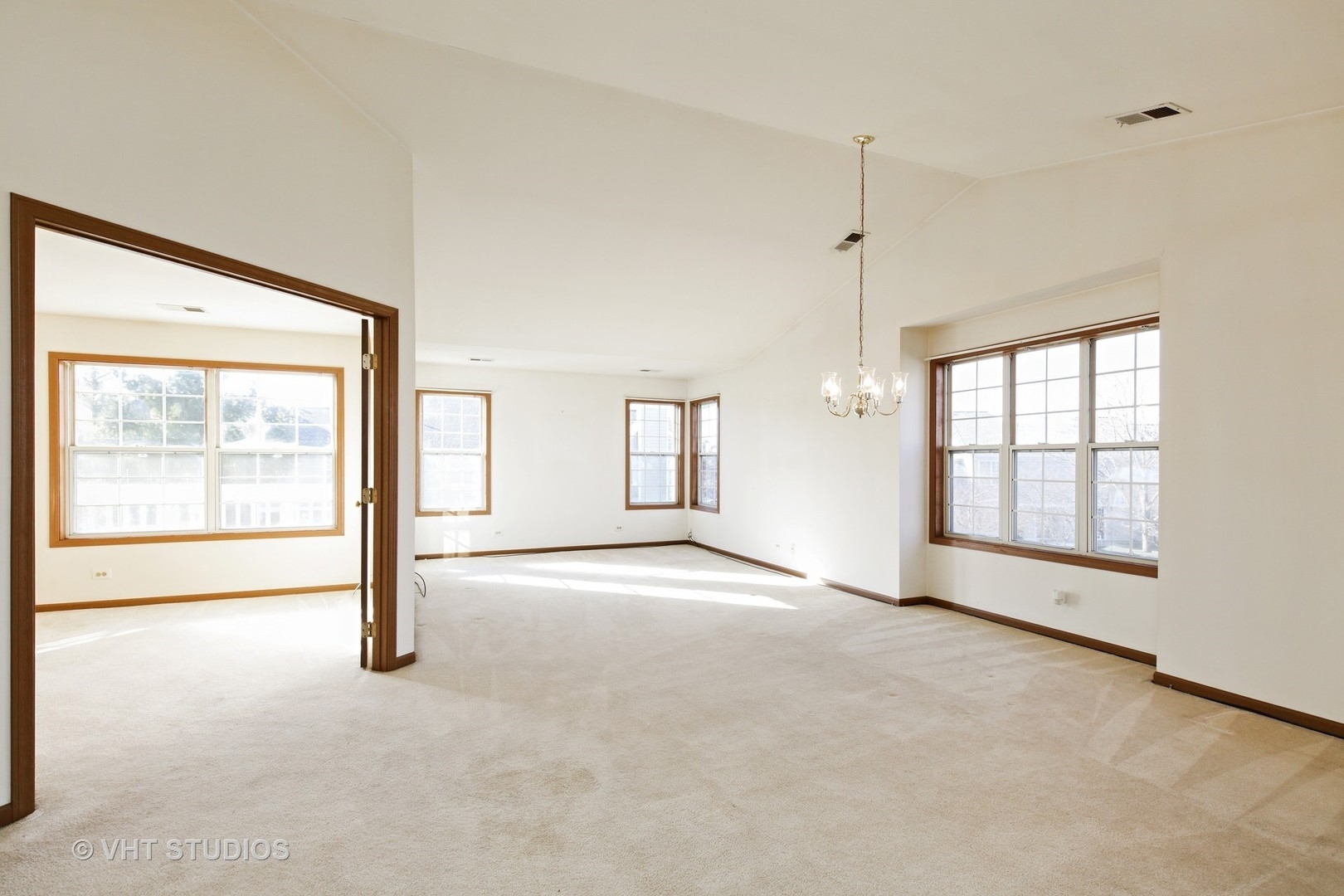 321 Sheffield Drive, Unit 321 Schaumburg, IL 60107 - Photo 7 of 21 a view of an empty room with a window