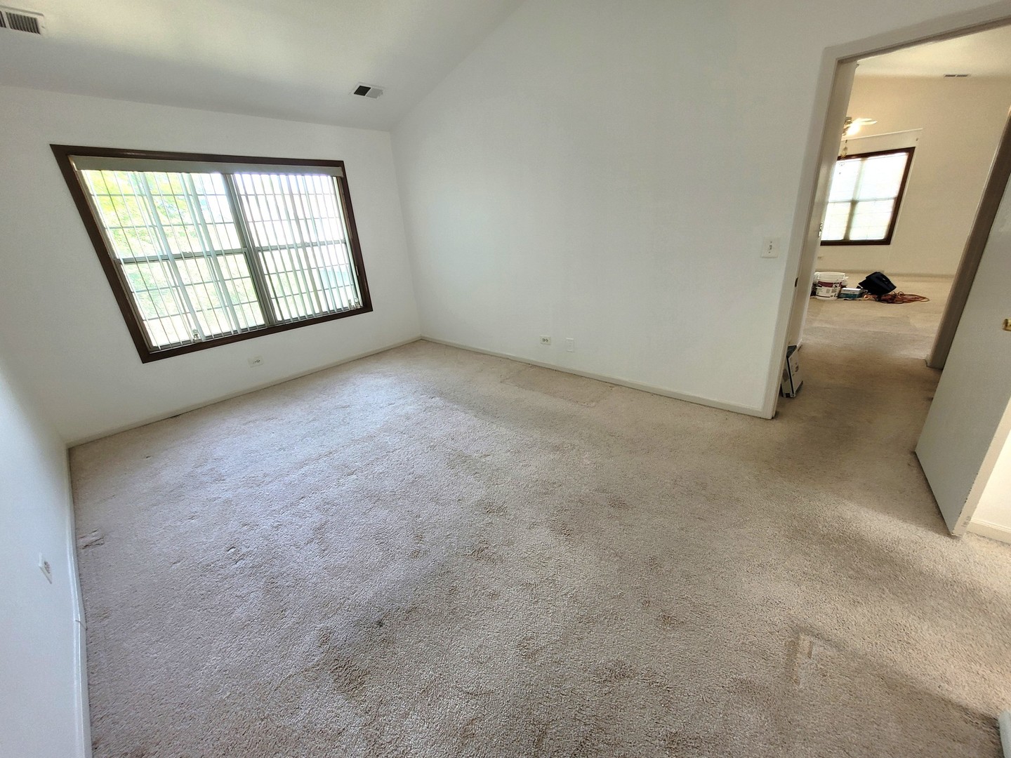321 Sheffield Drive, Unit 321 Schaumburg, IL 60107 - Photo 10 of 21 an empty room with windows and closet