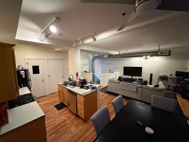 a kitchen with a sink appliances and cabinets