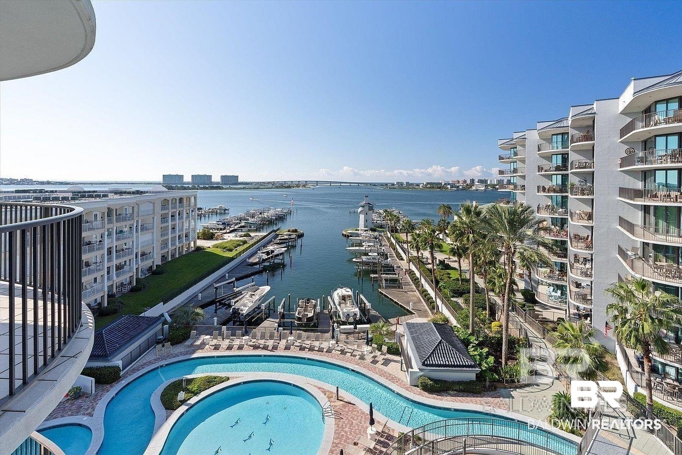 27582 Canal Road, Unit 2611 Orange Beach, AL 36561 - Photo 2 of 37 Community pool featuring a water view