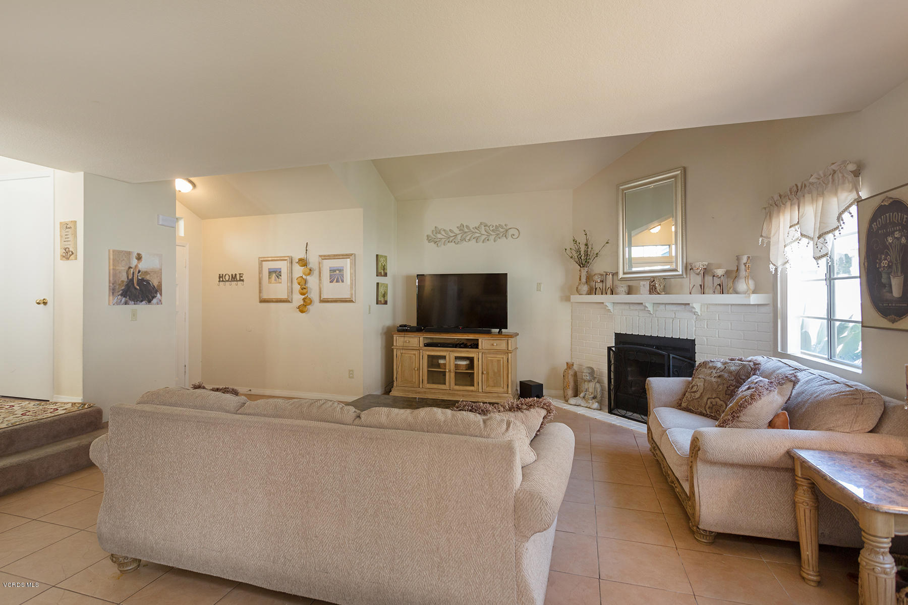 1920 Rory Lane, Unit 3 Simi Valley, CA 93063 - Photo 2 of 10 a living room with furniture and a flat screen tv