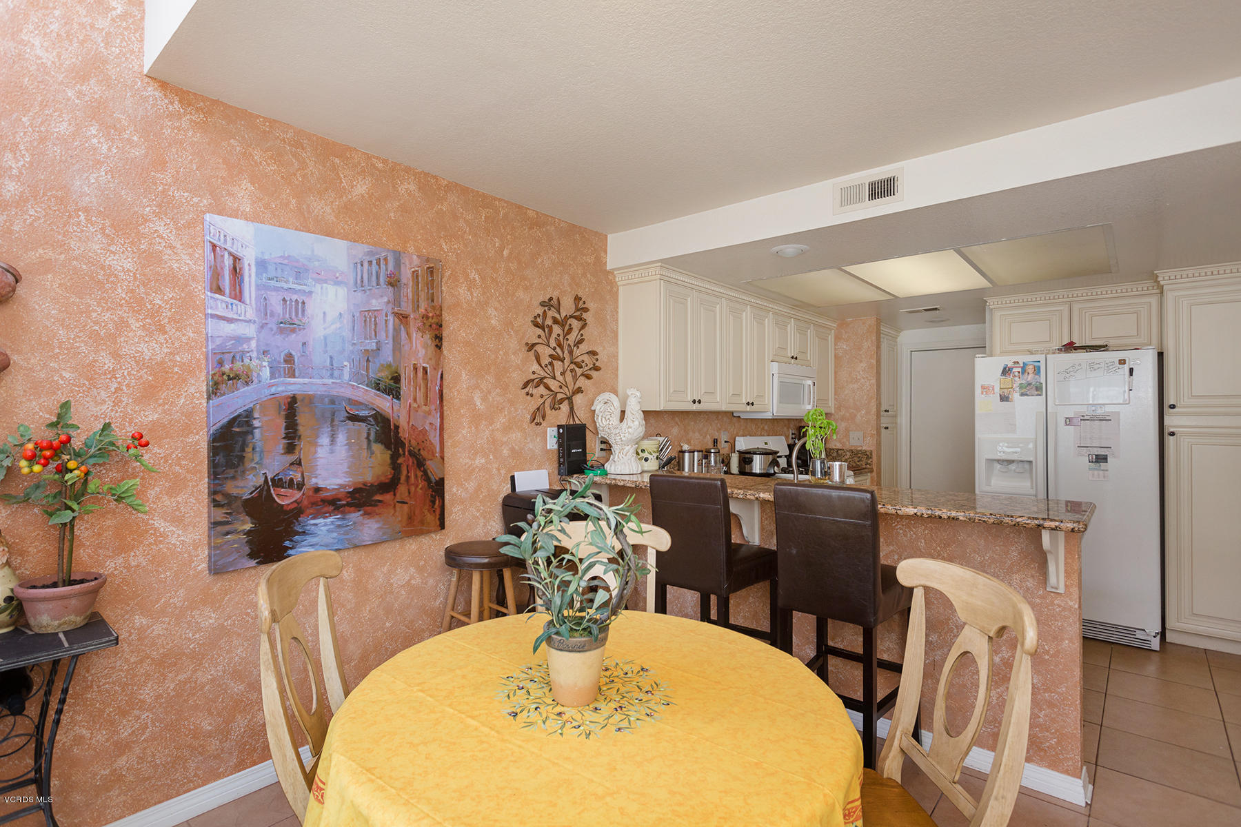 1920 Rory Lane, Unit 3 Simi Valley, CA 93063 - Photo 5 of 10 a dining room with furniture a large window and stainless steel appliances