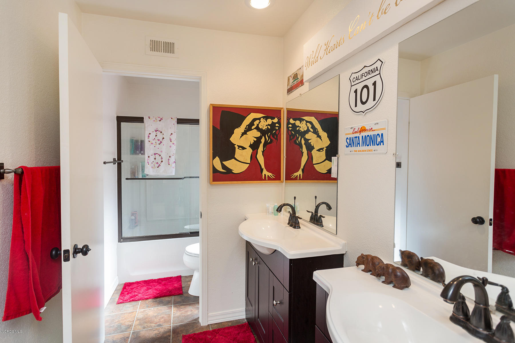 1920 Rory Lane, Unit 3 Simi Valley, CA 93063 - Photo 8 of 10 a bathroom with a sink and a mirror
