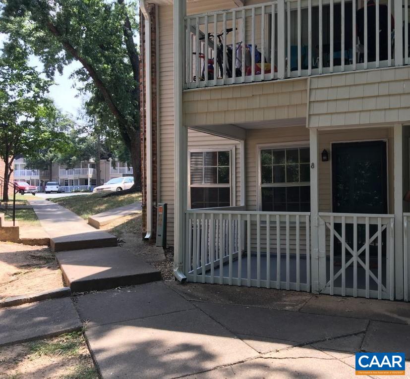 455 Burgoyne Road, Unit 8 Charlottesville, VA 22901 - Photo 1 of 12 a view of a house with a floor to ceiling window and wooden fence