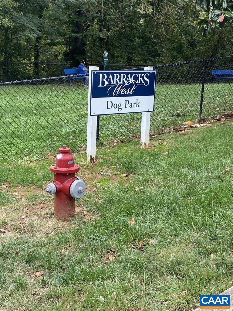 455 Burgoyne Road, Unit 8 Charlottesville, VA 22901 - Photo 11 of 12 a wooden bench sitting in the middle of a park