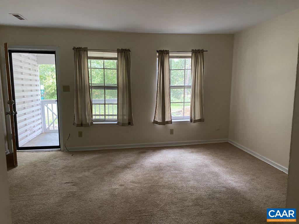 455 Burgoyne Road, Unit 8 Charlottesville, VA 22901 - Photo 5 of 12 an empty room with windows