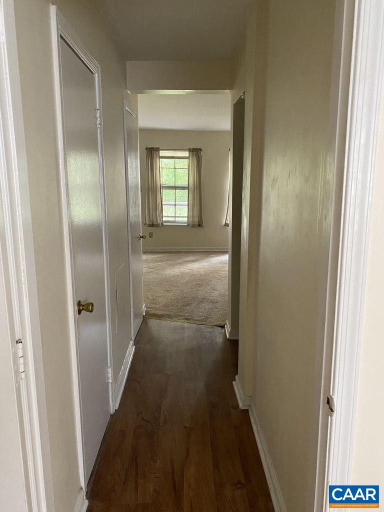 455 Burgoyne Road, Unit 8 Charlottesville, VA 22901 - Photo 8 of 12 a view of a bathroom from a hallway
