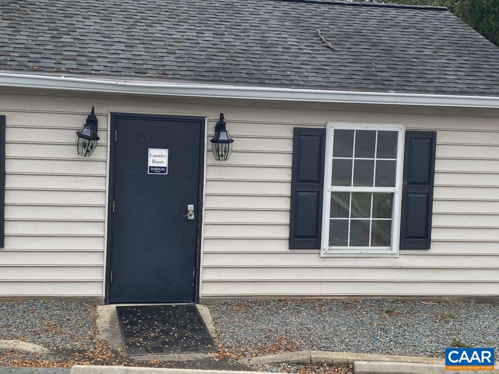 455 Burgoyne Road, Unit 8 Charlottesville, VA 22901 - Photo 10 of 12 a black and white door of a house