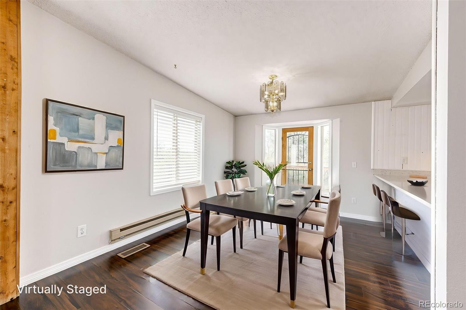 7417 Rafter Road Franktown, CO 80116 - Photo 15 of 37 a view of a dining room with furniture window and wooden floor