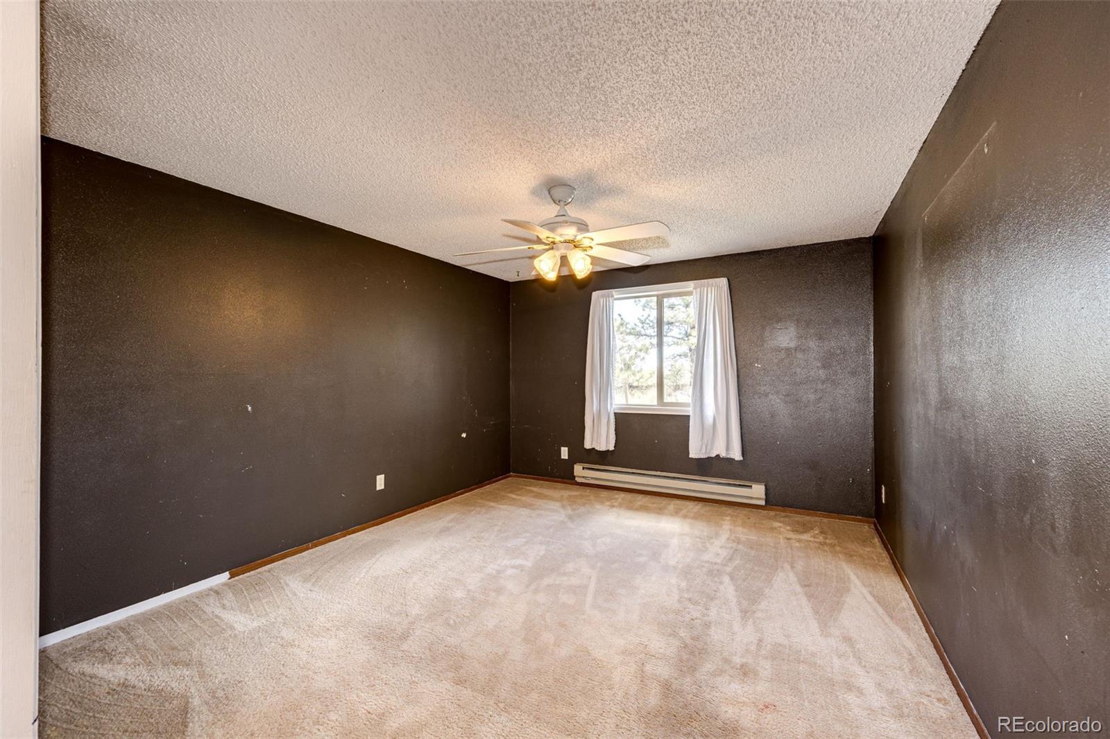 7417 Rafter Road Franktown, CO 80116 - Photo 19 of 37 a view of a livingroom with a window