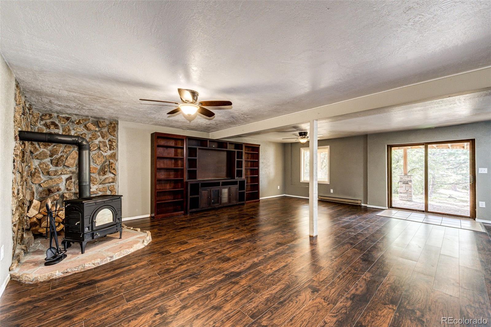 7417 Rafter Road Franktown, CO 80116 - Photo 24 of 37 a view of a livingroom with furniture and a ceiling fan