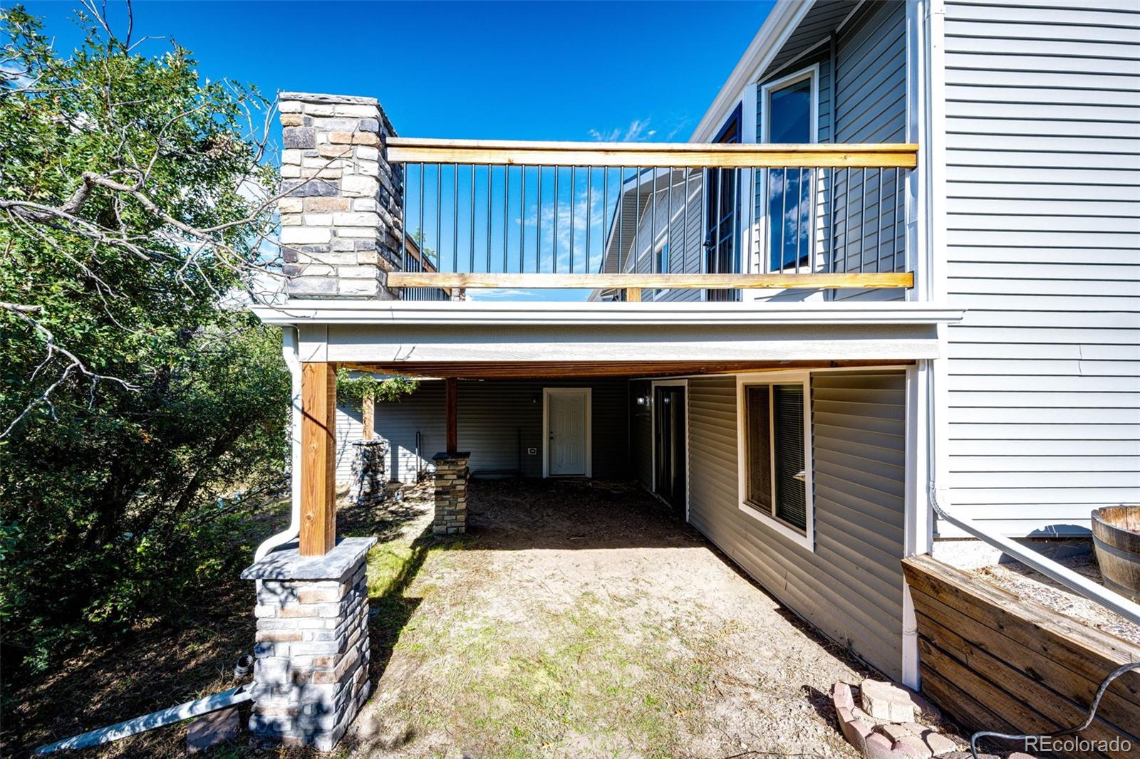 7417 Rafter Road Franktown, CO 80116 - Photo 33 of 37 a view of deck with patio