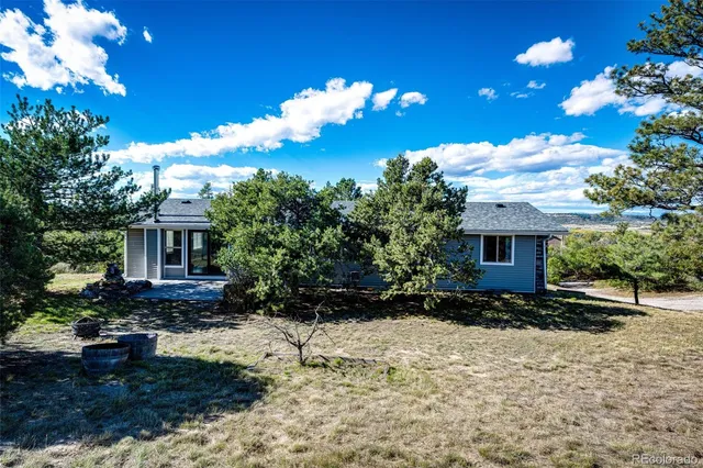 a house with trees in front of it