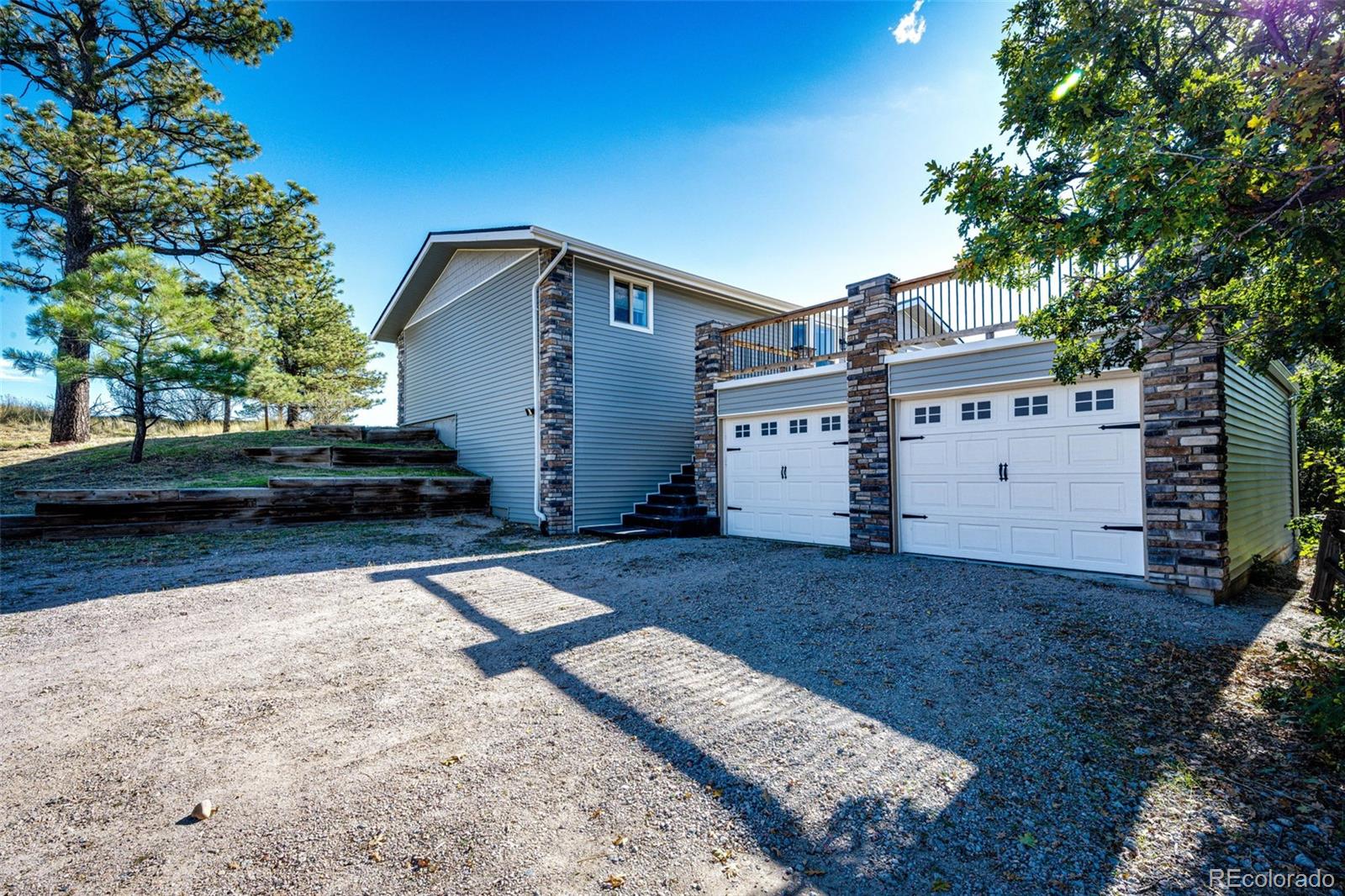 7417 Rafter Road Franktown, CO 80116 - Photo 7 of 37 a view of a house with a yard