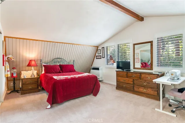 a living room with furniture pool table and a potted plant