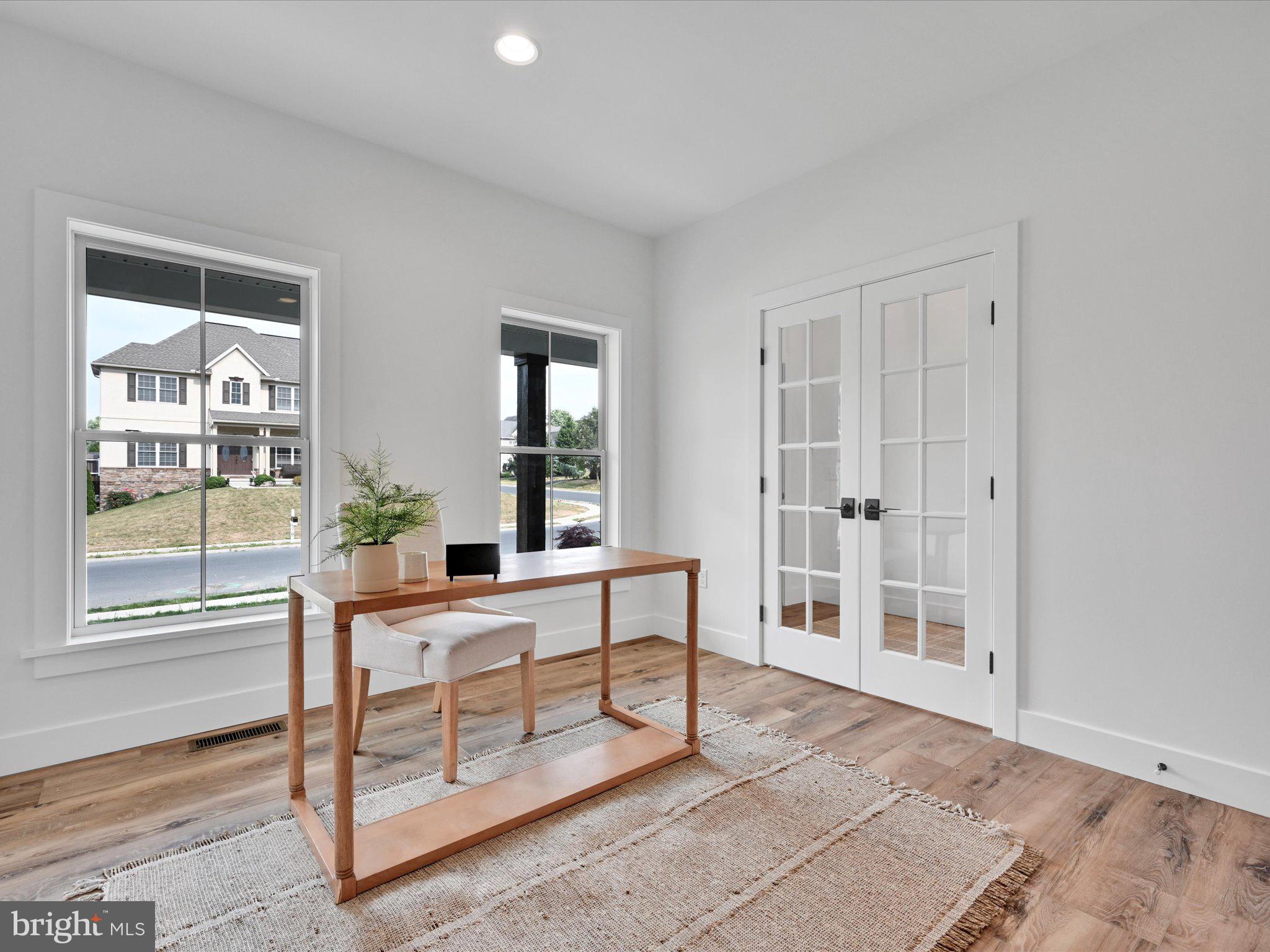 335 Royal Hunt Way Lititz, PA 17543 - Photo 11 of 49 a living room with furniture a window and a glass door