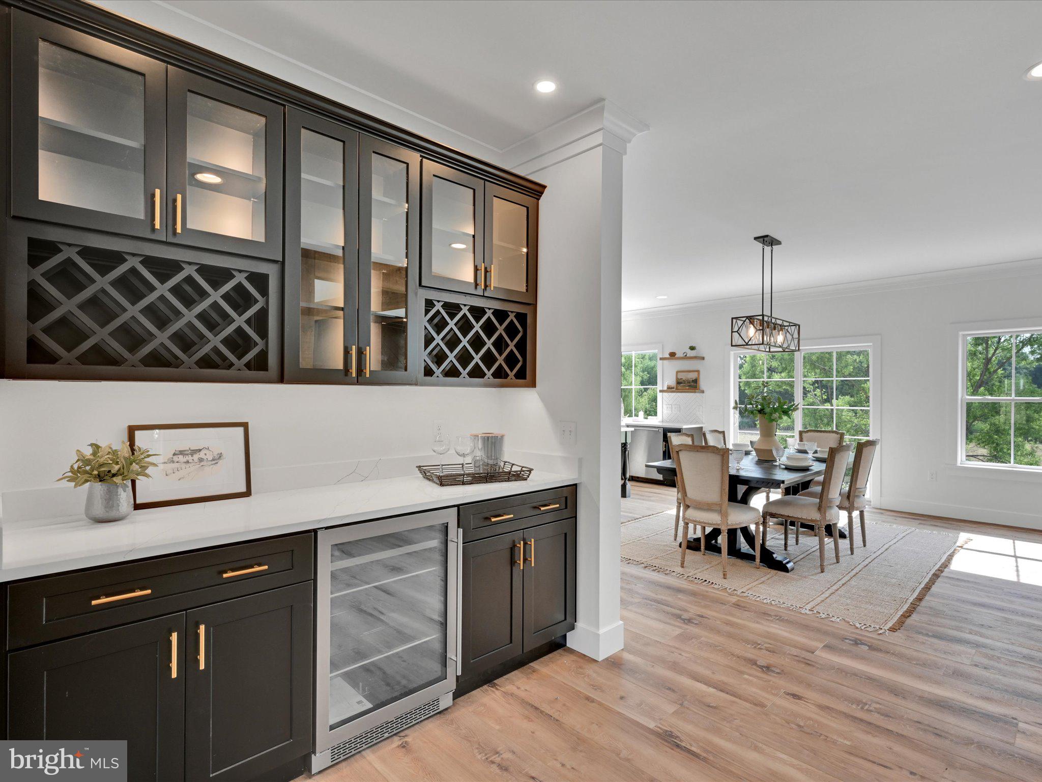 335 Royal Hunt Way Lititz, PA 17543 - Photo 17 of 49 a kitchen with a sink and wooden cabinets