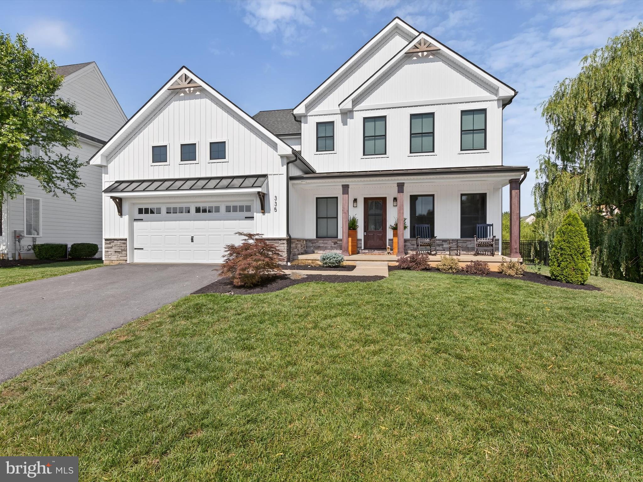 335 Royal Hunt Way Lititz, PA 17543 - Photo 2 of 49 a front view of a house with a yard