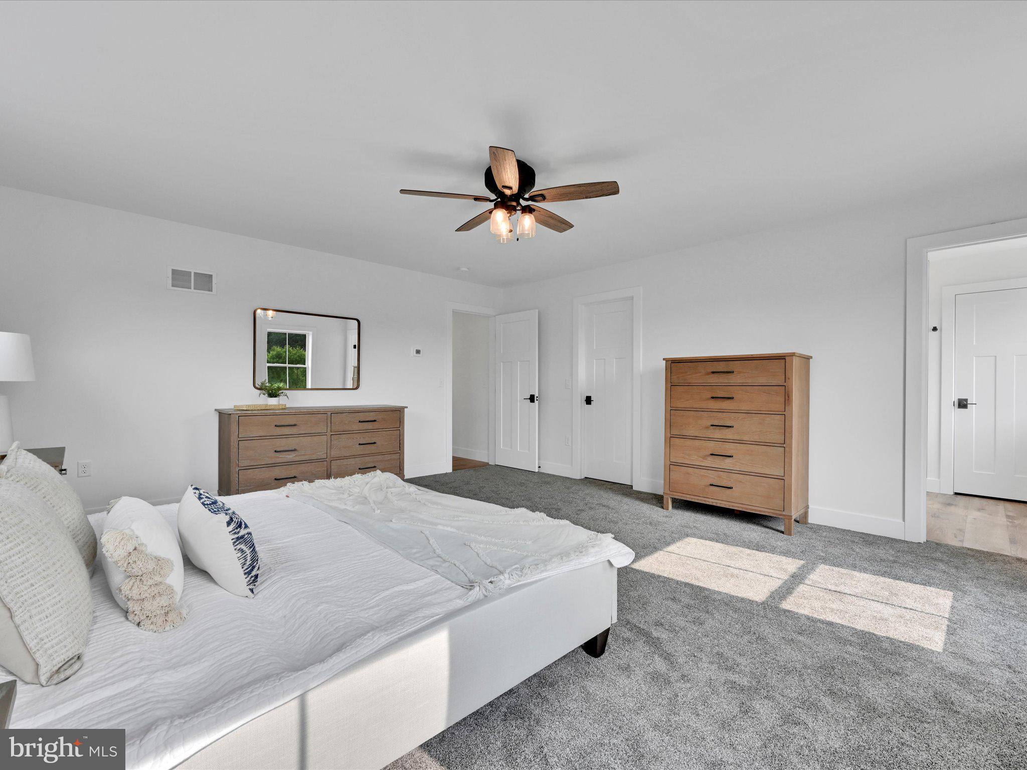 335 Royal Hunt Way Lititz, PA 17543 - Photo 27 of 49 a bedroom with a bed and a ceiling fan