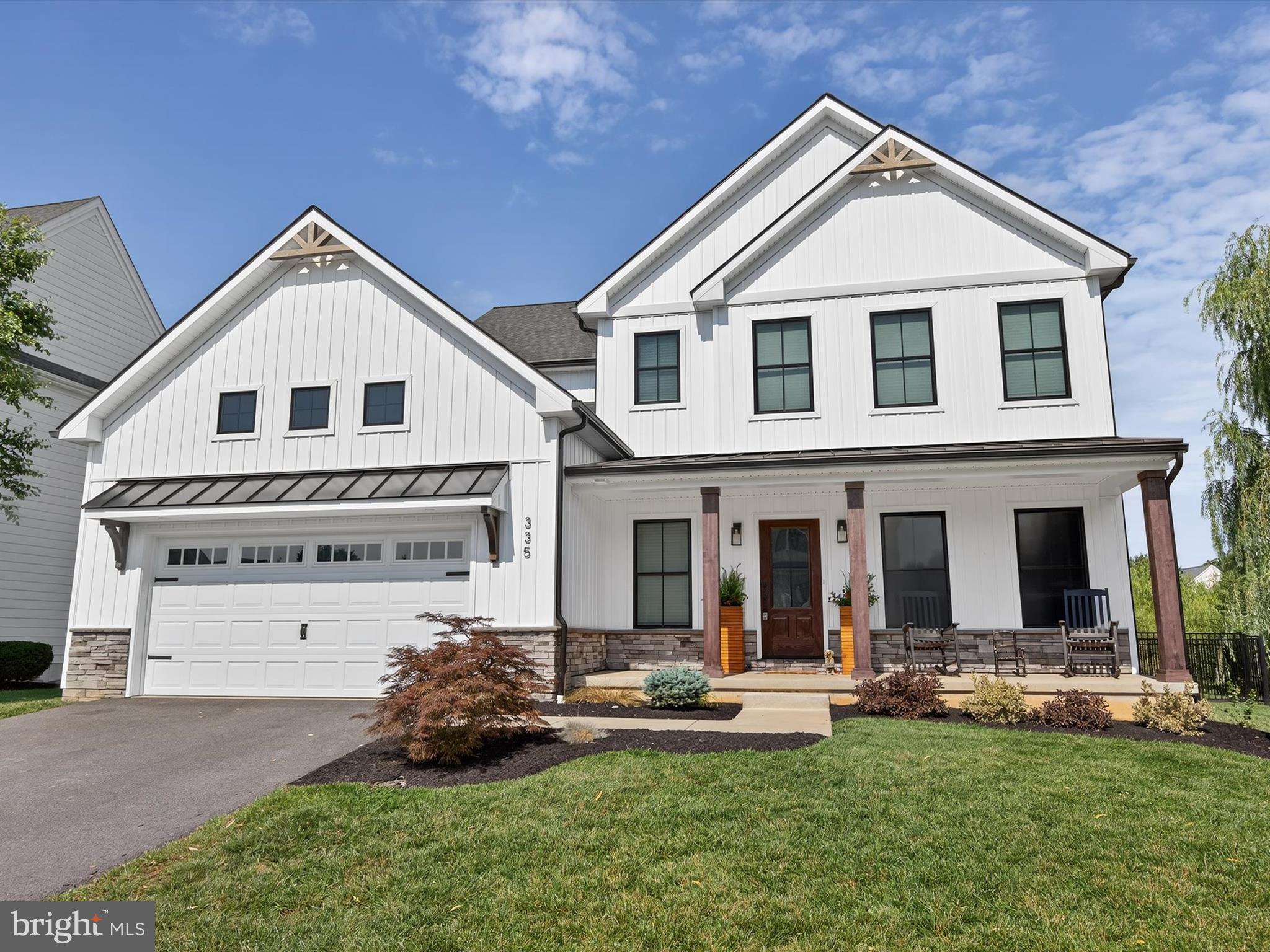 335 Royal Hunt Way Lititz, PA 17543 - Photo 8 of 49 a front view of a house with a garden and plants