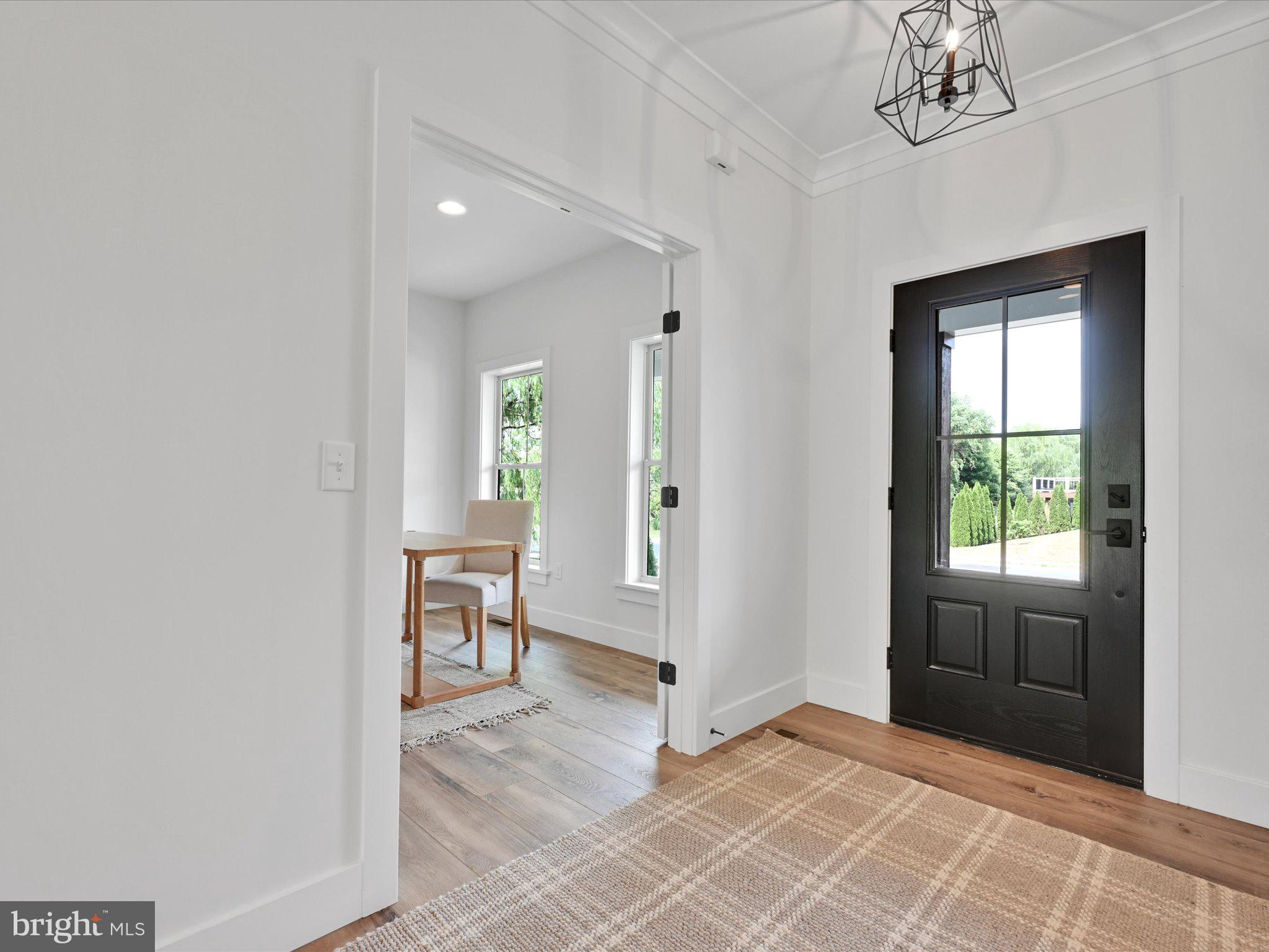 335 Royal Hunt Way Lititz, PA 17543 - Photo 10 of 49 a view of an entryway with wooden floor and a livingroom
