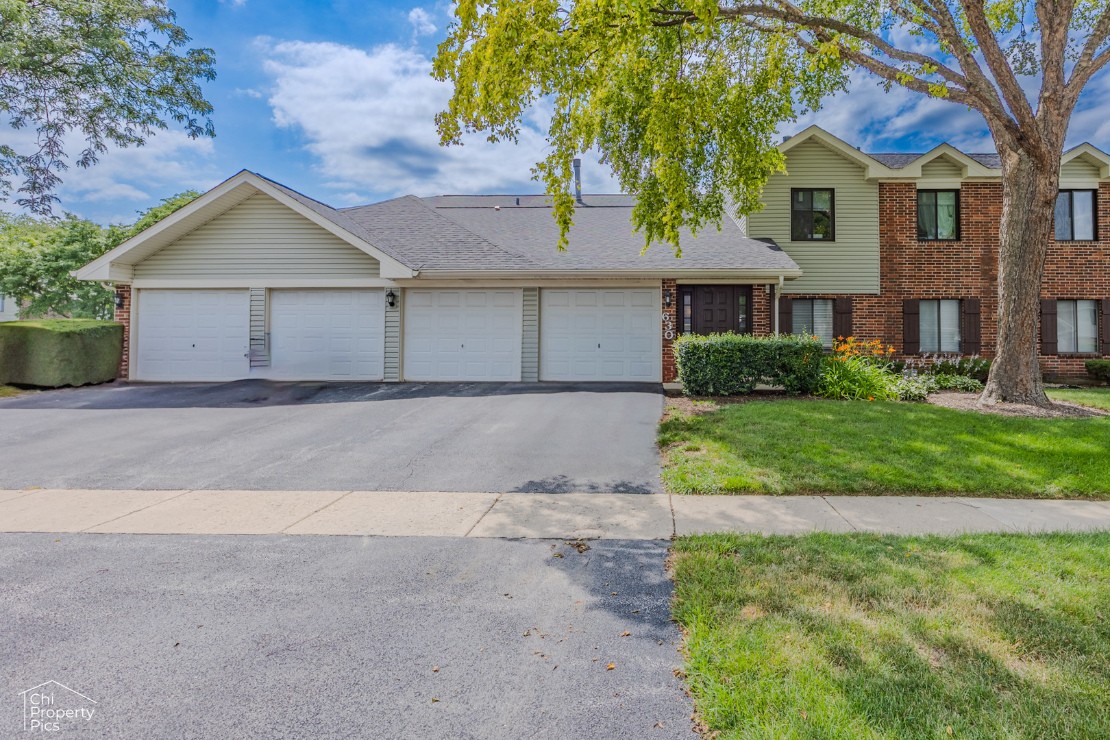630 Cumberland Trail, Unit AA1 Roselle, IL 60172 - Photo 1 of 23 a front view of house with yard and green space