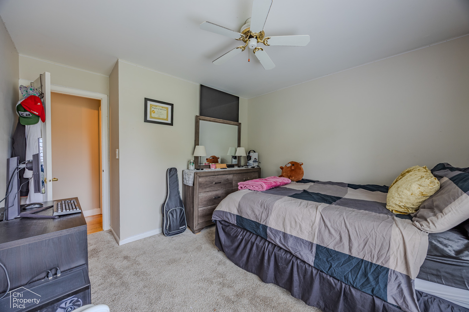 630 Cumberland Trail, Unit AA1 Roselle, IL 60172 - Photo 14 of 23 a bedroom with a bed and a chandelier