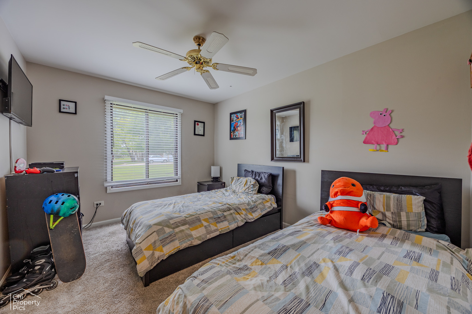 630 Cumberland Trail, Unit AA1 Roselle, IL 60172 - Photo 15 of 23 a bedroom with a bed and a chandelier