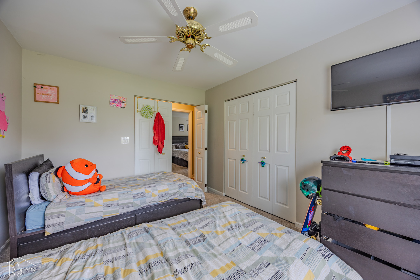 630 Cumberland Trail, Unit AA1 Roselle, IL 60172 - Photo 16 of 23 a bedroom with a bed and a chandelier