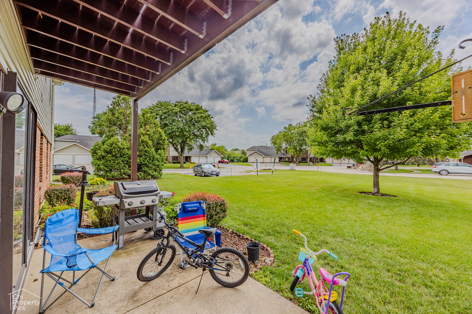 630 Cumberland Trail, Unit AA1 Roselle, IL 60172 - Photo 22 of 23 a view of a small yard with a patio