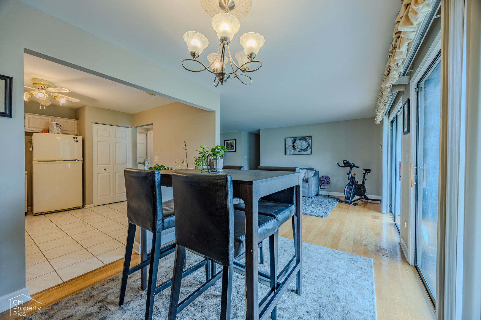 630 Cumberland Trail, Unit AA1 Roselle, IL 60172 - Photo 6 of 23 a view of a dining room with furniture and a chandelier