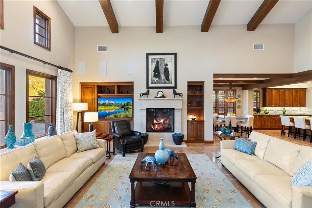 41 Cassis Circle Rancho Mirage, CA 92270 - Photo 12 of 74 a living room with furniture fireplace and flat screen tv