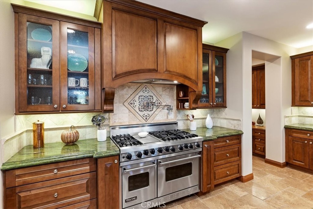41 Cassis Circle Rancho Mirage, CA 92270 - Photo 20 of 74 a kitchen with stainless steel appliances granite countertop a stove and a sink