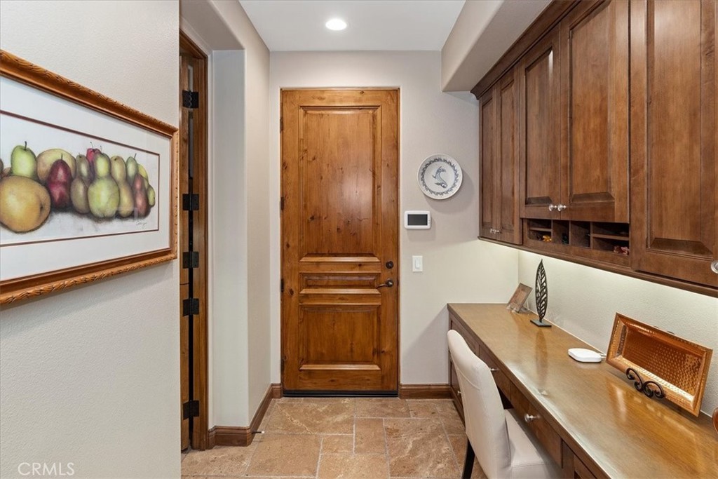41 Cassis Circle Rancho Mirage, CA 92270 - Photo 26 of 74 a view of a kitchen with a refrigerator cabinets and a window