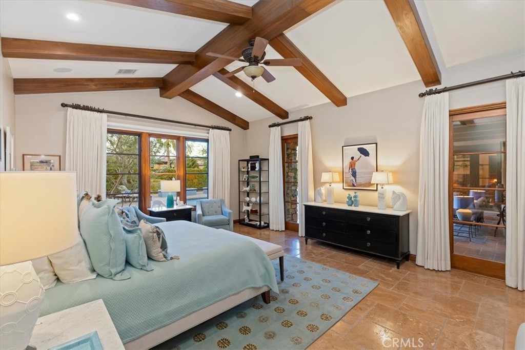 41 Cassis Circle Rancho Mirage, CA 92270 - Photo 30 of 74 a large bedroom with a bed and large windows