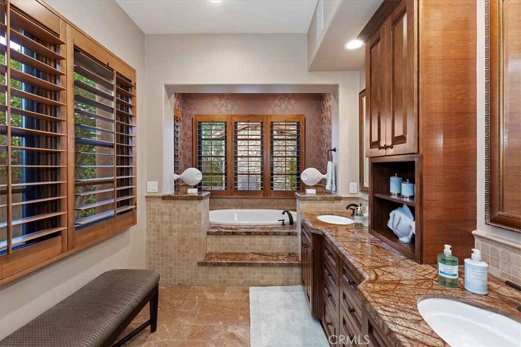 41 Cassis Circle Rancho Mirage, CA 92270 - Photo 31 of 74 a large living room with granite countertop furniture and a fireplace