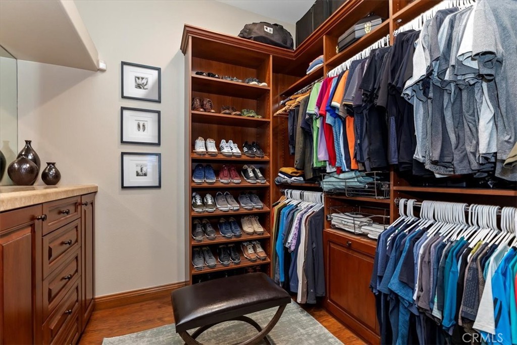 41 Cassis Circle Rancho Mirage, CA 92270 - Photo 34 of 74 a view of walk in closet with clothes and shoes