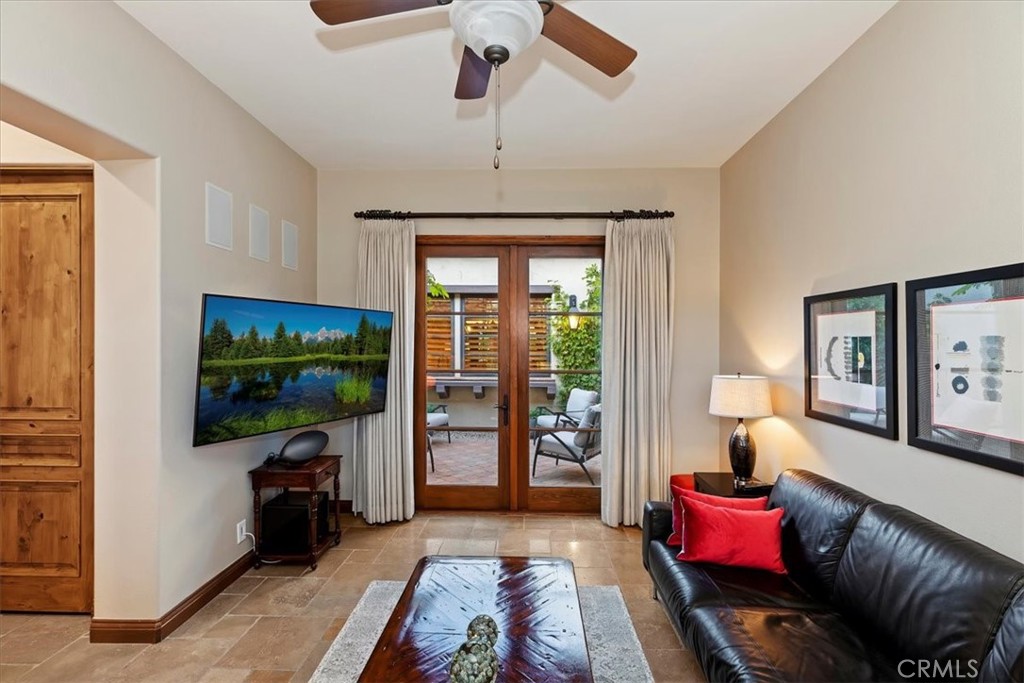 41 Cassis Circle Rancho Mirage, CA 92270 - Photo 36 of 74 a living room with furniture and a flat screen tv