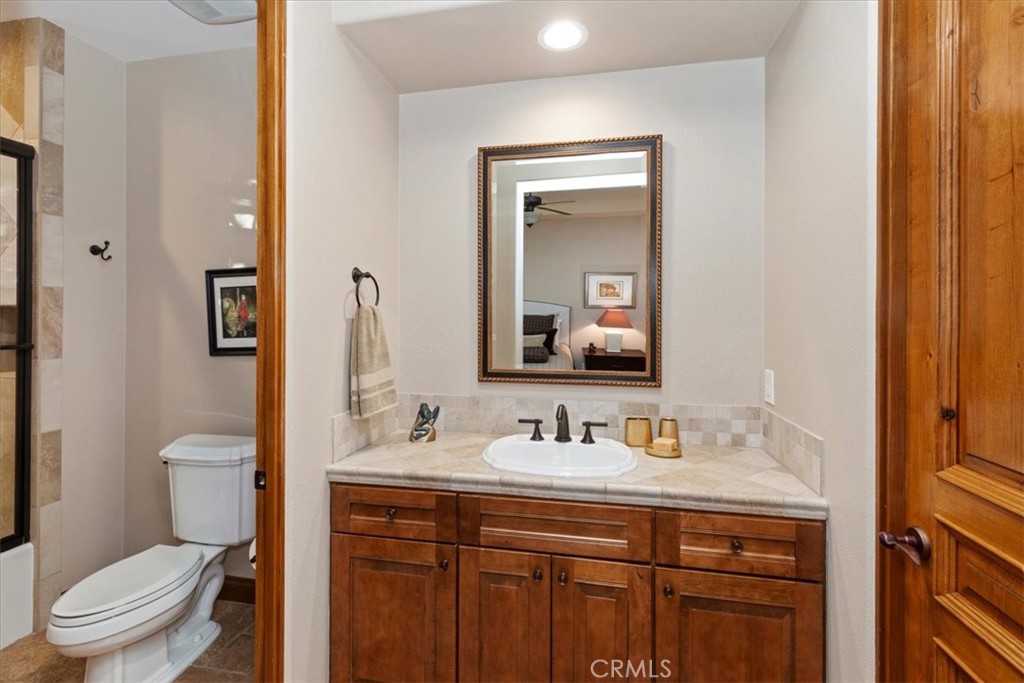 41 Cassis Circle Rancho Mirage, CA 92270 - Photo 38 of 74 a bathroom with a toilet sink and mirror