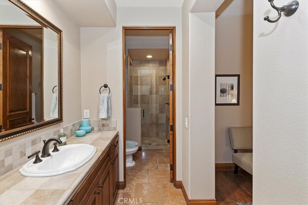 41 Cassis Circle Rancho Mirage, CA 92270 - Photo 44 of 74 a en suite bathroom with a sink a toilet and shower