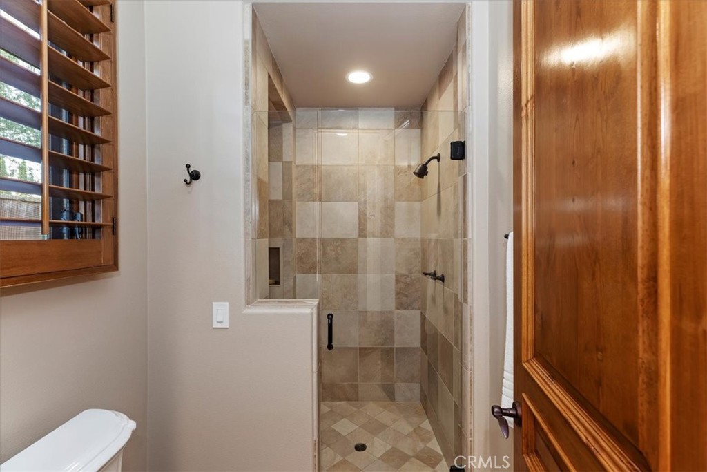 41 Cassis Circle Rancho Mirage, CA 92270 - Photo 45 of 74 a bathroom with a shower and toilet